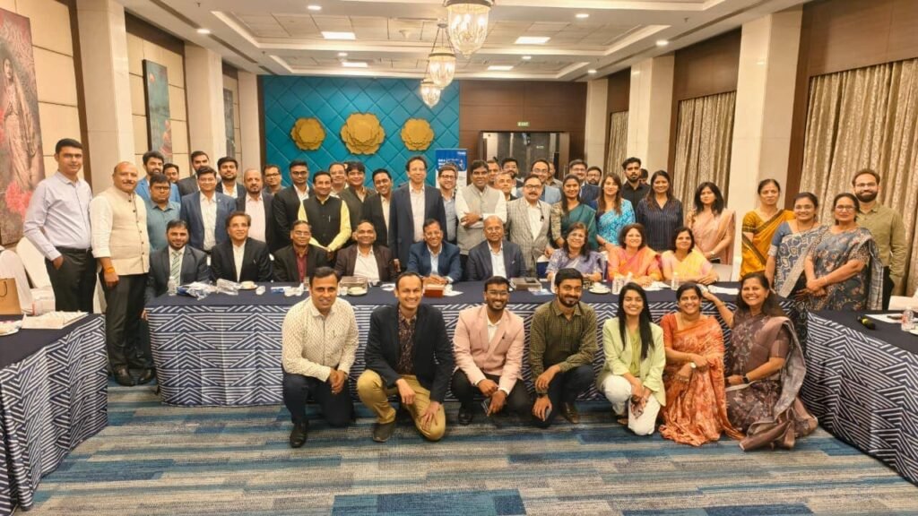 Group photograph of MIBF members and business professionals at the Indore meeting.